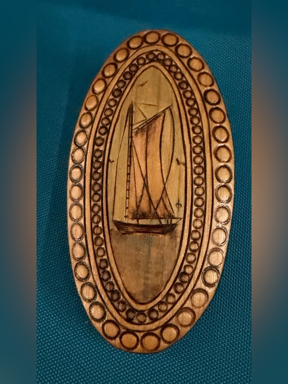 Hand-Carved Oval Sailing Boat Brooch in Warm Wood Tones